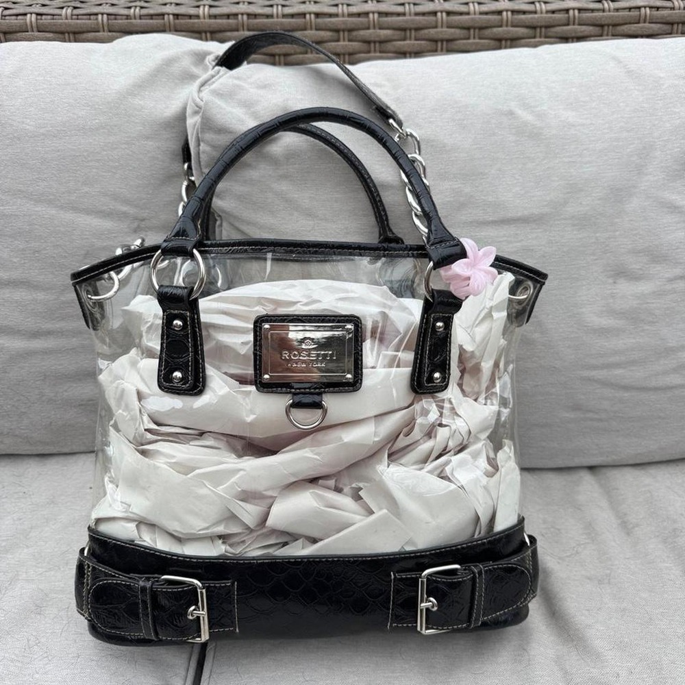 Rosetti New York clear handbag featuring sleek black leather trim